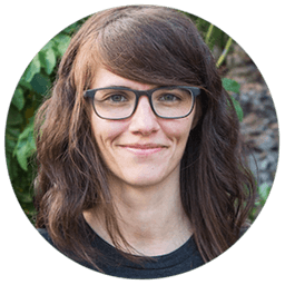 Person guiding another person while holding hands